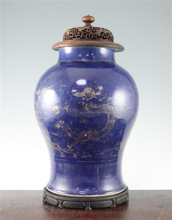 A Chinese gilt-decorated blue ground baluster jar, 19th century, 35cm, wood stand and cover, gilt decoration worn